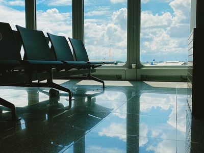 Sunlight streaming through a window onto an empty floor.